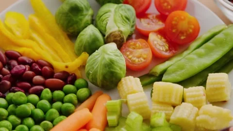 Close-Up of Fresh Tomatoes, Corn, Peas and Brussels Sprouts Stock Footage 339111301