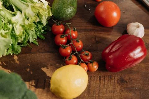 Close-up of fresh vegetables on the kitchen table. Vegetarian food concept Stock Photos