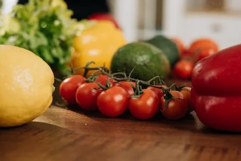 Close-up of fresh vegetables on the kitchen table. Vegetarian food concept Stock Photos