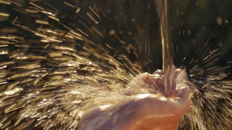 Close-up of fresh water falling on a hand Video stock 67042802