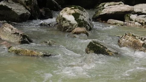 Close up fresh water stream rapid flowing over the rocks in tropical forest Stock Footage 144818331