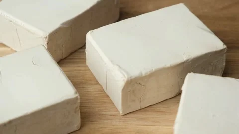 Close-up of fresh wet yeast for baking. Slow rotating Stock Footage 309759043