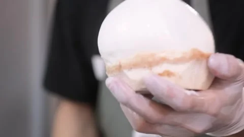 Close-up of Fresh White Peeled Coconut Meat Shell Stock Footage 345650375
