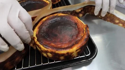 Close-up of a freshly baked Basque burnt cheesecake Stock Footage 331785673