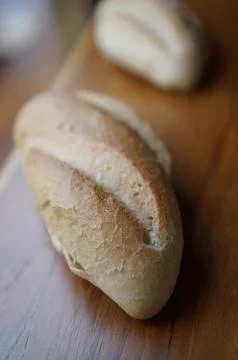Close-Up of Freshly Baked Bread Rolls on Wooden Table, Selective Focus Stock Photos