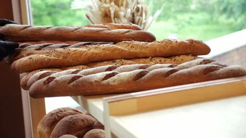 Close-up of freshly baked bread on the shelf of a store or bakery. Stock Footage 339787900
