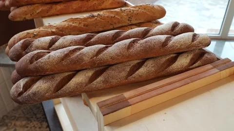 Close-up of freshly baked bread on the shelf of a store or bakery. Stock Footage 340245392