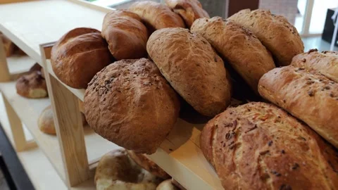 Close-up of freshly baked bread on the shelf of a store or bakery. Stock Footage 340245660