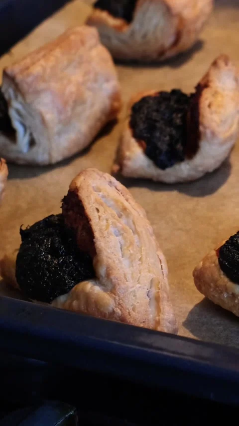 Close-up of freshly baked hot Leaf Fat Pastry on a baking tray Stock Footage 270555912