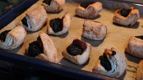 Close-up of freshly baked hot Leaf Fat Pastry on a baking tray Stock Footage 270556853