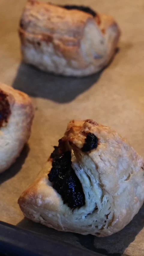 Close-up of freshly baked hot Leaf Fat Pastry on a baking tray Stock Footage 270556977