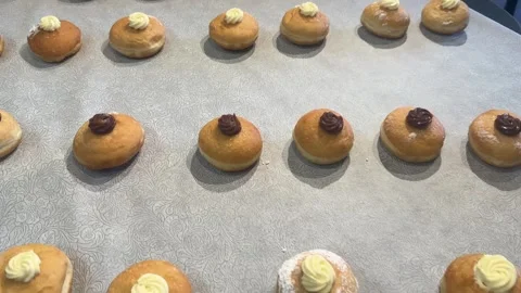 Close-up of freshly baked sufganiyot Stock Footage 296577142