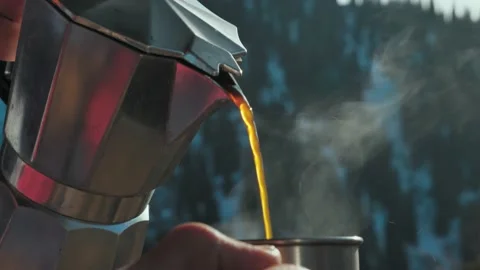 Close-up of freshly brewed coffee pouring from a coffee pot into a mug 스톡 동영상 144096090