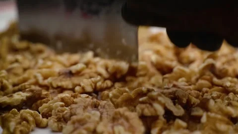 Close-up of Freshly Chopped Walnuts on a Dessert Pie Tart Surface Stock Footage 337751561