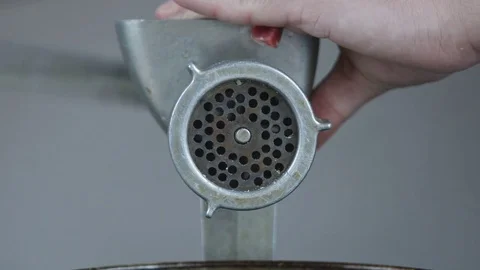 Close up of freshly ground meat coming out of a meat grinder 스톡 동영상 74344441