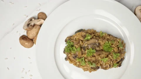 Close up of freshly made mushroom risotto with ingredients on the side in 4K. Stock Footage 134698661