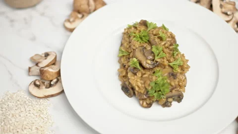 Close up of freshly made mushroom risotto with ingredients on the side in 4K. Stock Footage 134698678