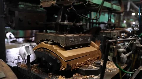 Close up of a freshly pressed unfired clay roof tile moving along a production Stock Footage 344247630