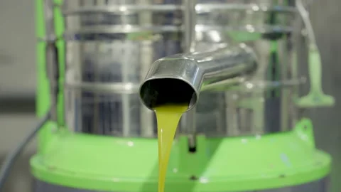 Close Up On freshly squeezed olive oil spills in factory 4K 60fps Stock Footage 219616797