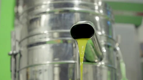 Close Up On freshly squeezed olive oil spills in factory 4K 60fps Stock Footage 219616814