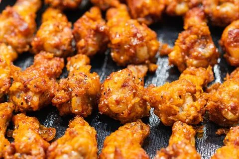 Close up of Fried Chicken Drumstick with garlic and pepper, thai street food Stock Photos