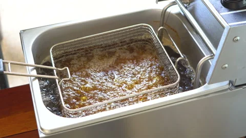 Close up fried chicken in fried pot with boiling cooking oil Stock Footage 134746184