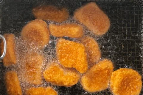 Close up of fried chicken	nuggets. Foto stock