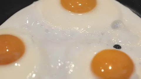 Close Up Fried Egg Cooking in Hot Pan Stock Footage 342667244