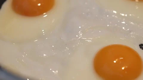 Close Up Fried Egg Cooking in Hot Pan Stock Footage 342667260