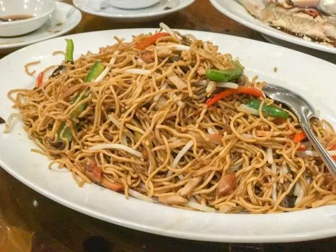 Close up of fried egg noodle with roasted pork Stock Photos