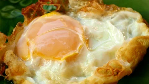 Close up fried egg in plate, in door Chiangmai Thailand. Stock Footage 220702483