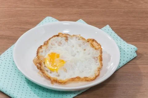 Close up of fried egg on plate Stock Photos