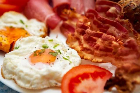 Close up of fried eggs with bacon Stock Photos