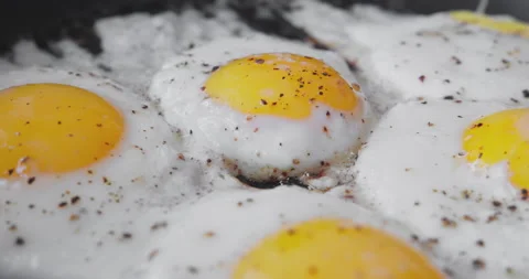 Close-up of fried eggs in a frying pan. Apple Prores 422 HQ. Video stock 167104386
