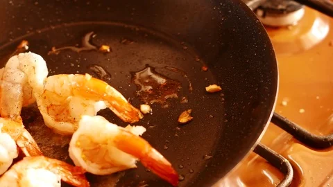 Close up of fried large prawns in a frying pan with oil. 4K UHD Stockbeeldmateriaal 73973249