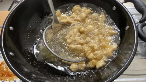 Close up fried meat or flour in a pan. boiling oil Stock Footage 227698265
