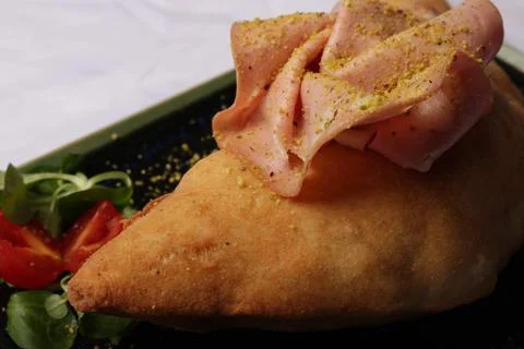 Close up of fried panzerotto hot stuffing. Stock Photos