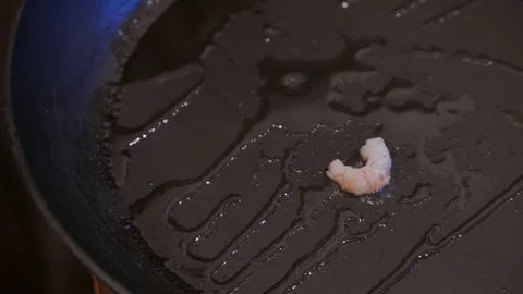 Close up of fried shrimps in a frying pan with oil. 4K UHD Stock Footage 73188335