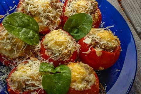 Close-up of fried stuffed tomatoes filled with spicy mixture. Stock Photos