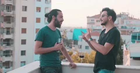 Close friends are drinking wine and speaking, laughing. Happy friendship, par Video stock 156332912