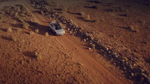 Close up front aerial view of a 4 by 4 car through the desert. Spain. Stock Footage 47329383