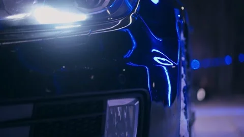 Close-up of the front of the car in neon lighting 스톡 동영상 147978906