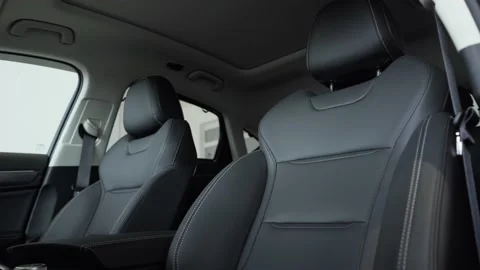 Close-up of the front car seats made of gray leather with white stitching. Stock Footage 155738987
