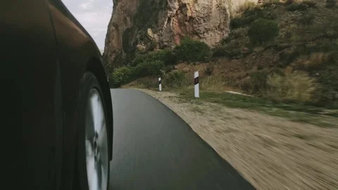Close up front car wheel point of view driving on asphalt alpine road in mo.. Stock Footage 290064912