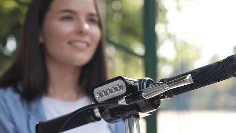 A close-up of the front of the electric scooter, in the background in defocus Stock Footage 116442726