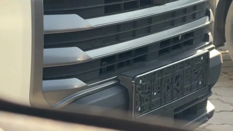 Close-up of the front grille and empty license plate holder on a modern vehicle, Stock Footage 337113264