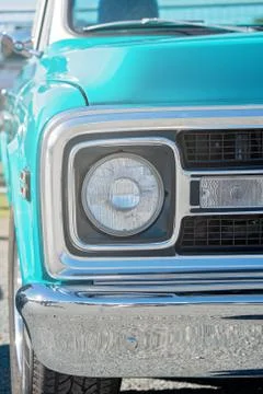 Close Up Of Front Headlight Of Blue Classic Car Stock Photos
