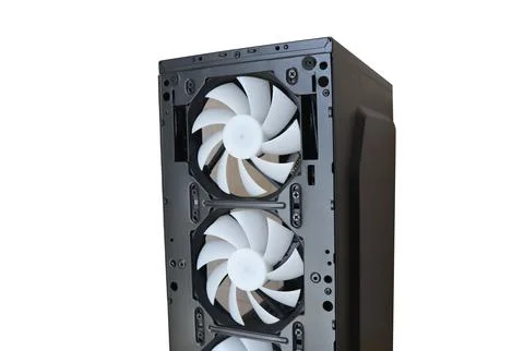 Close-up front interior view of a black computer case showing white cooling.. Stock Photos