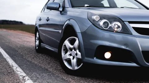 Close up front of new silver car parking on road Stock Photos
