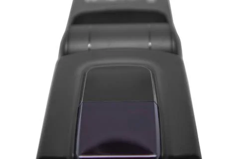Close-up of the front optical sensor and AF assist beam on a black camera f.. Фото